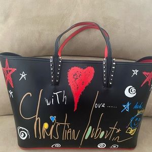 Christian Louboutin NWOT,  front is hearts and Christian Louboutin name.